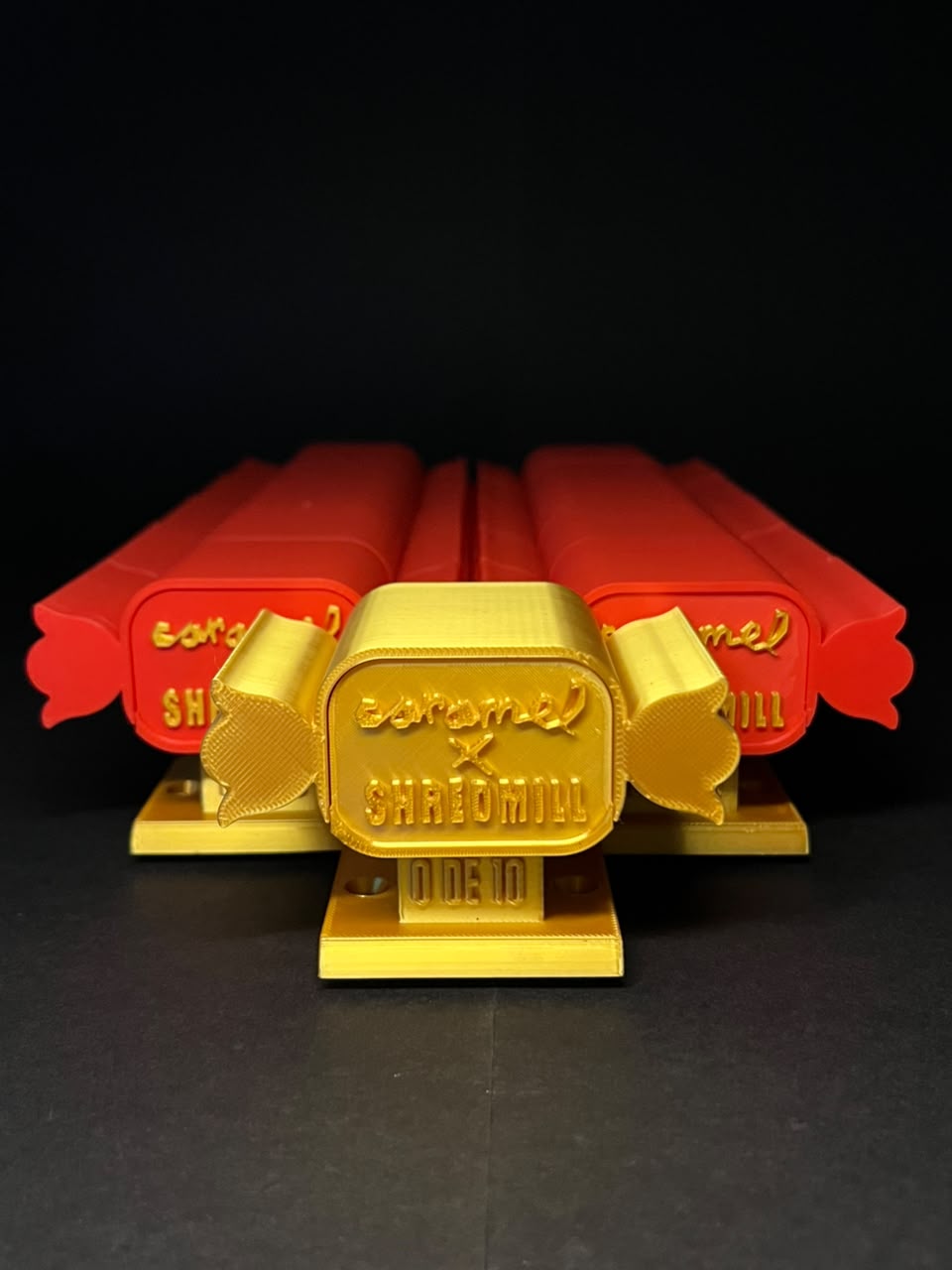 Red and gold pieces from the Caramel and Shredmill collaboration