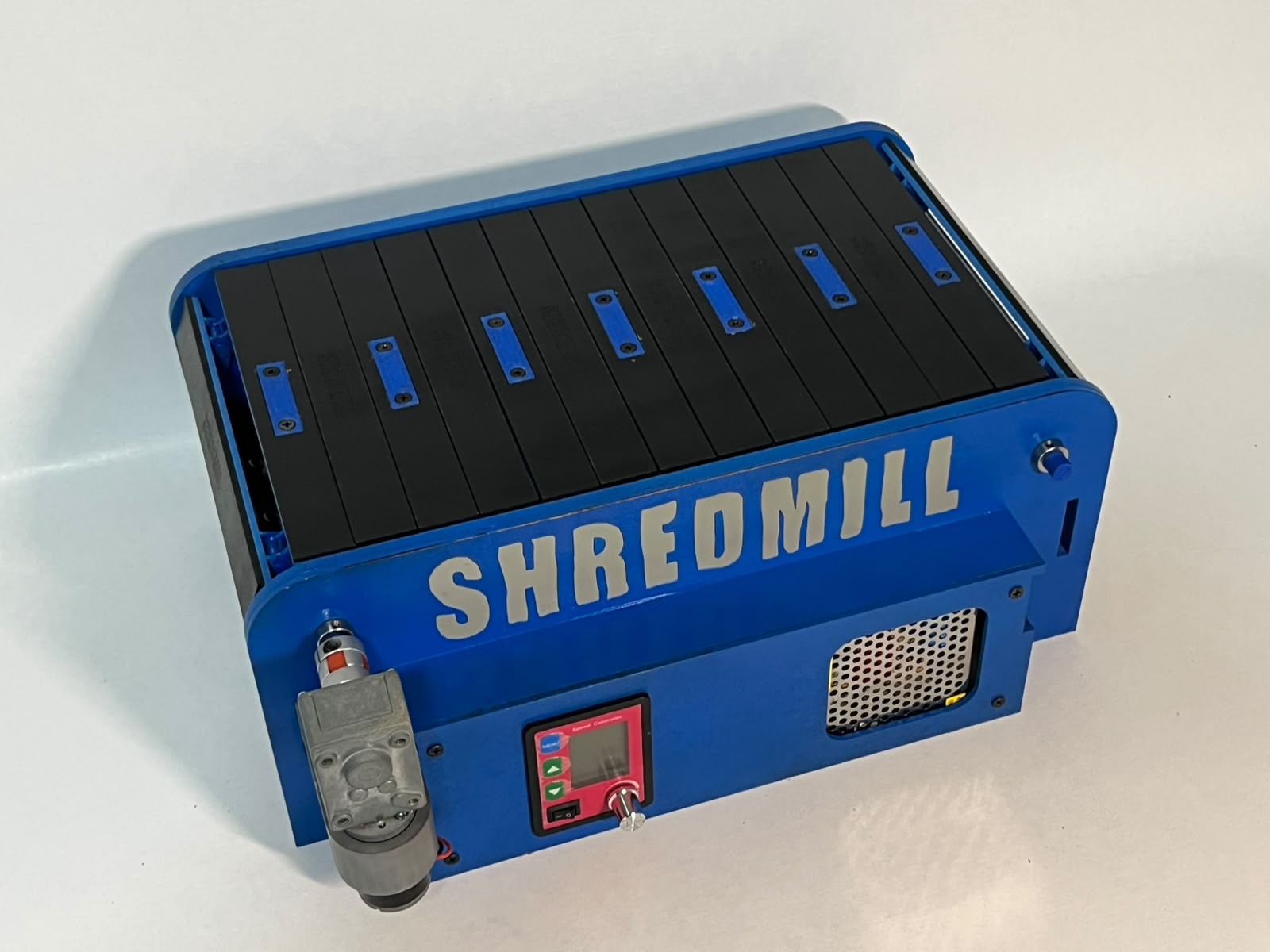 Overhead perspective of the blue Shredmill base, front panel and moving surface