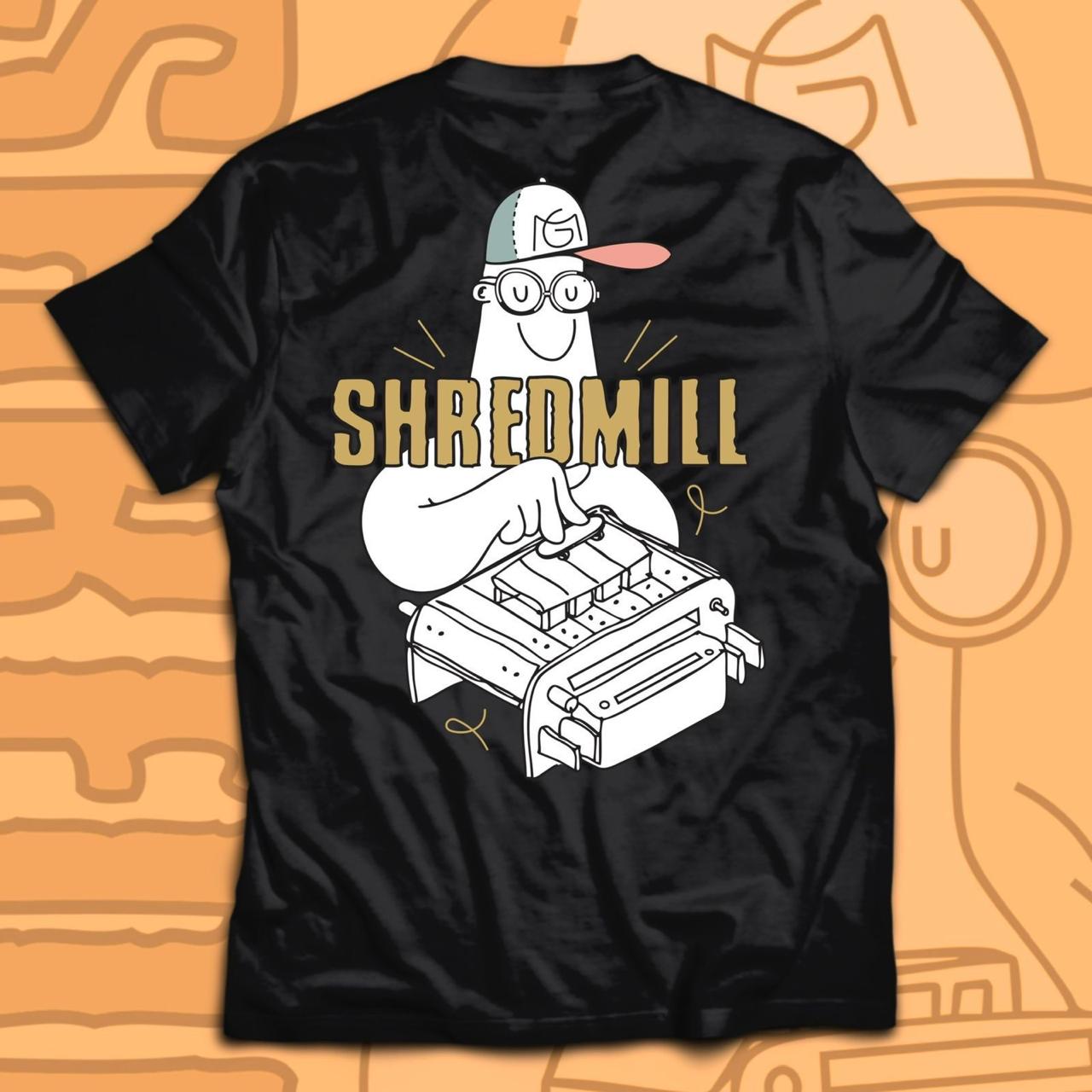 Black Shredmill graphic tee on a gold background